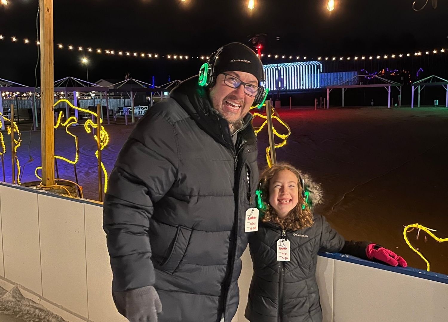An image of a father and his daughter taking a picture at Candy Village.