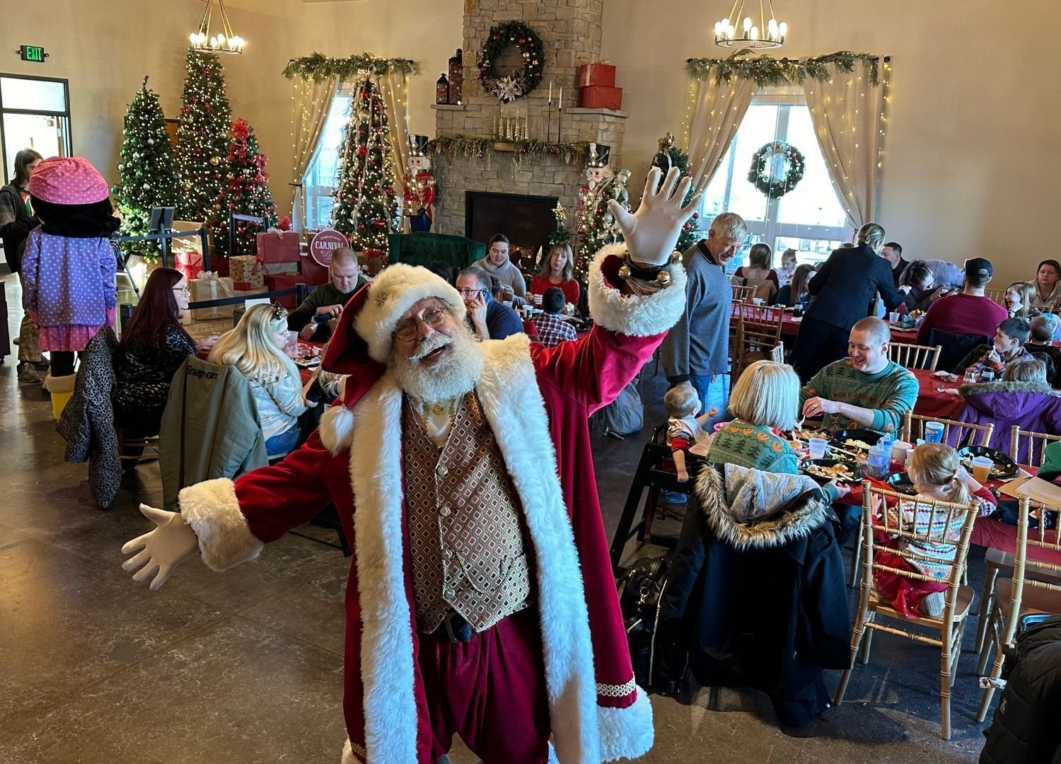 An image of Santa posing at his workshop.