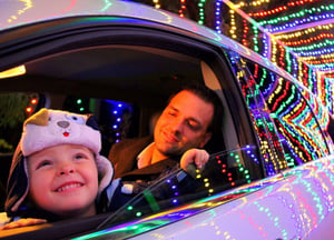 An image of a father and his daughter looking at the lights at the Light Tunnel