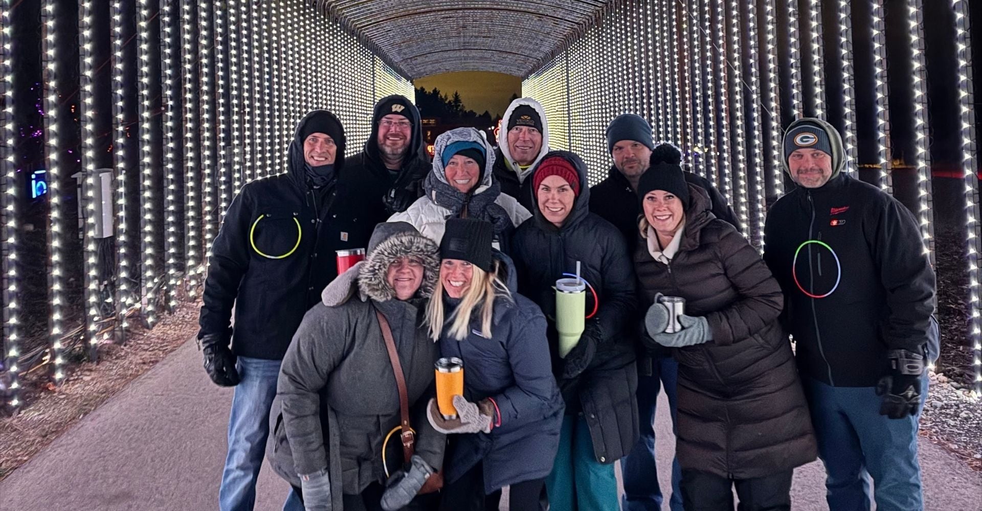 group of adults enjoying the walk through night event at the Christmas Carnival of Lights group of adults enjoying the walk through night event at the Christmas Carnival of Lights